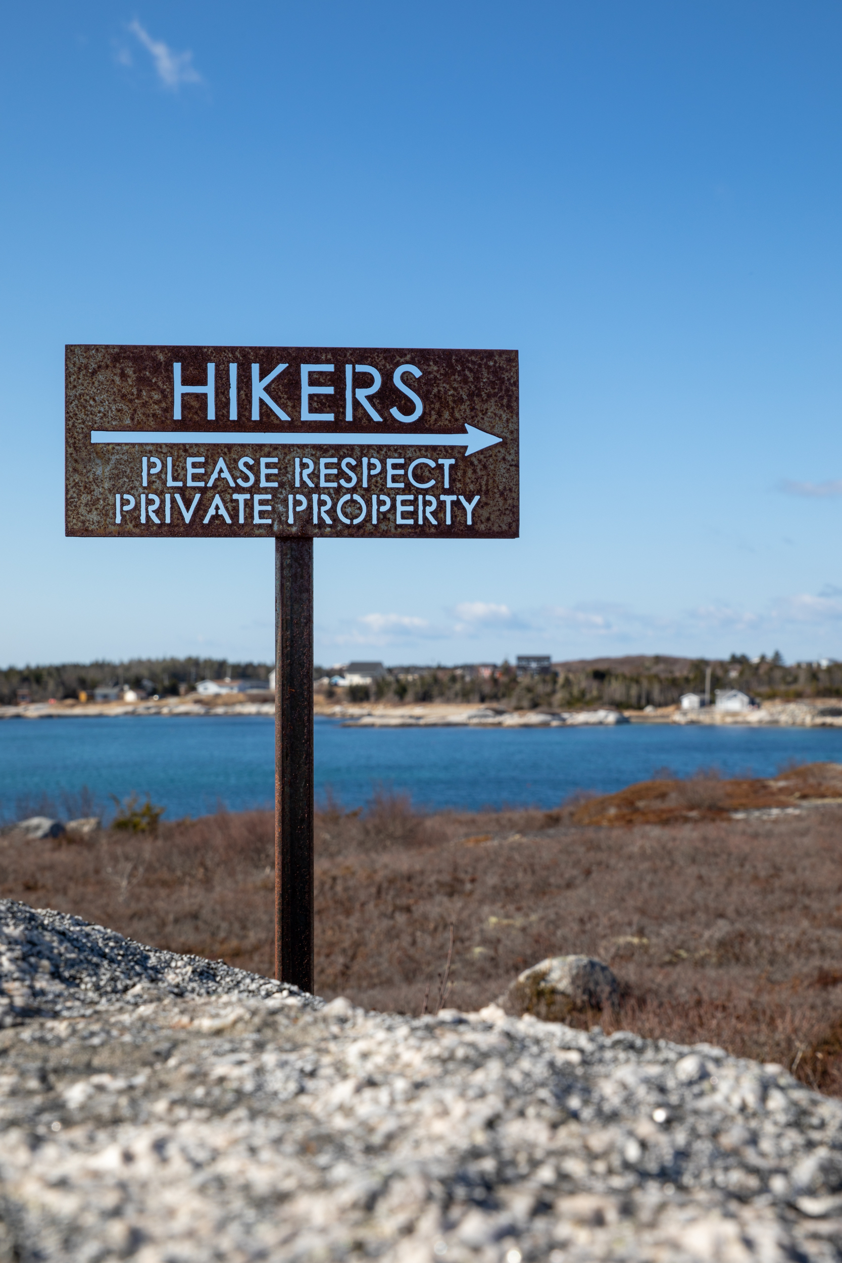 a no trespassing sign on a beach